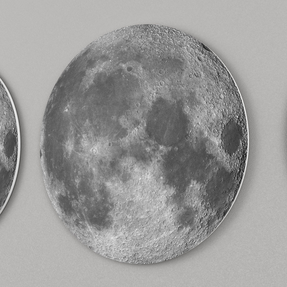 lose-up of moon phase wall decor showing detailed lunar surface and layered 3D design