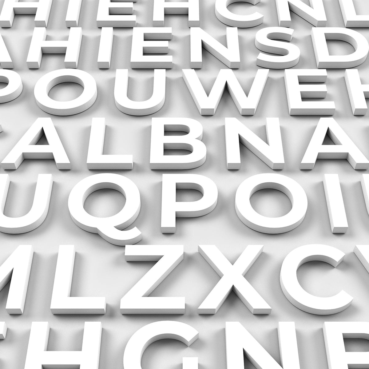 A close-up shot of white 3D PVC letters arranged in rows and columns. The letters are in a sans-serif font and are evenly spaced. The letters are casting shadows on a light gray surface.