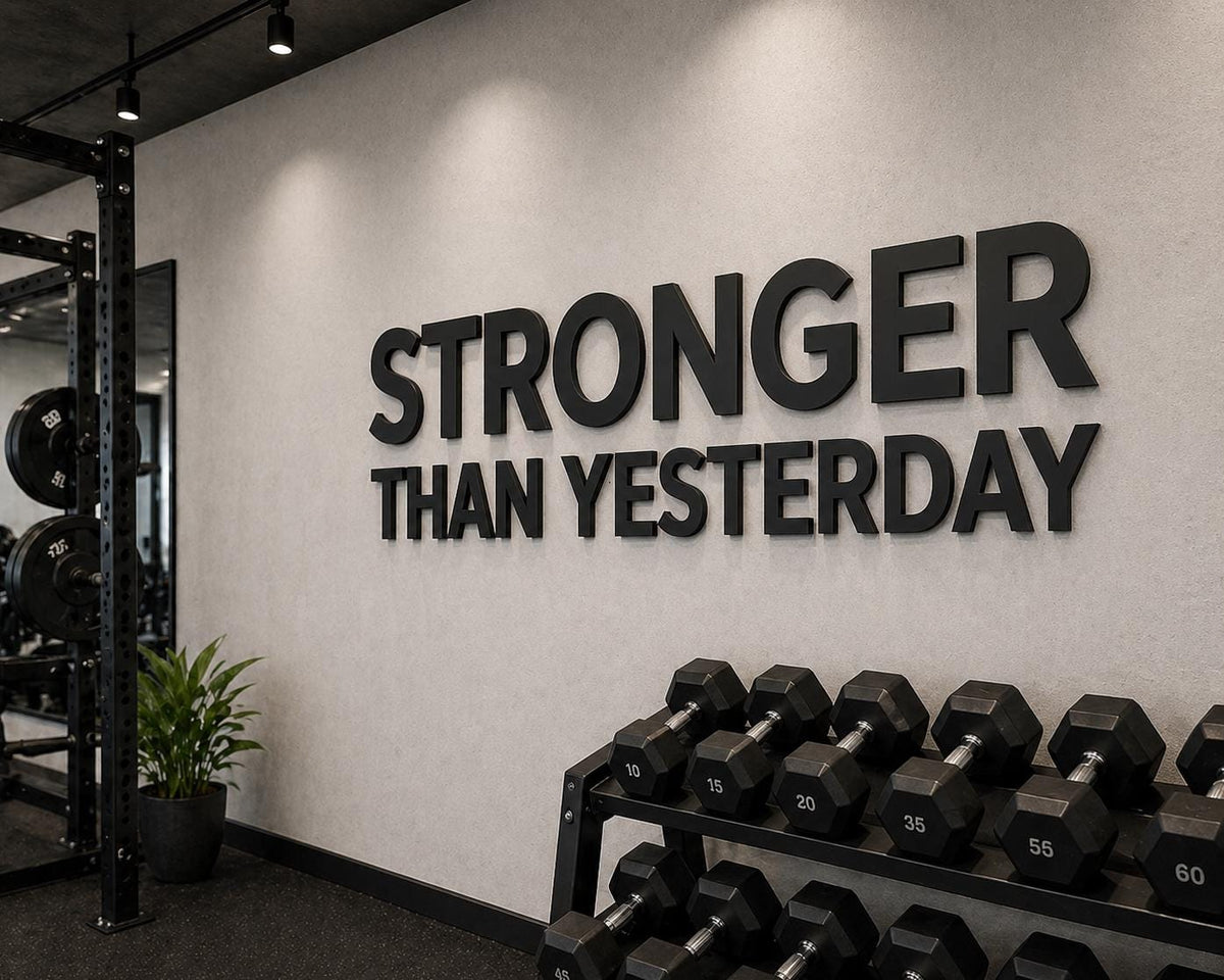 stronger than yesterday gym sign matte black PVC wall letters clean modern home gym wall decor